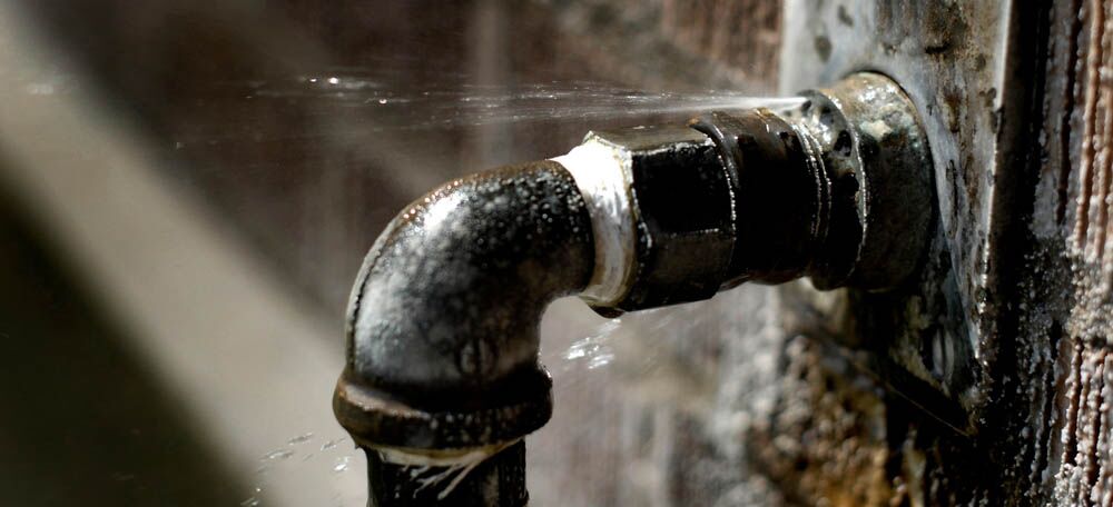 water gushing from burst pipe water gushing from burst pipe